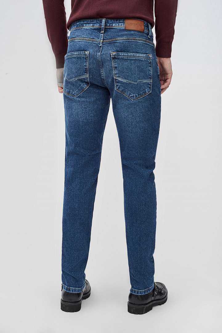 Зауженные джинсы с эффектом потертости