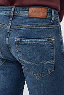 Зауженные джинсы с эффектом потертости